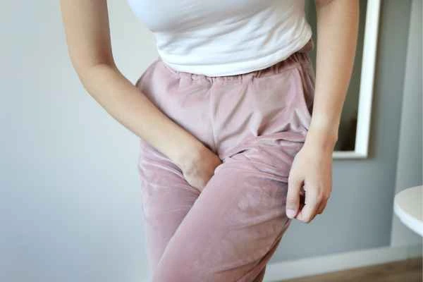 woman running for the toilet because of urinary incontinence Nottingham